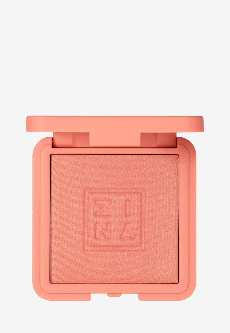 Rubor melocotón en un compacto cuadrado color coral. Textura suave con logo en relieve. La tapa tiene una bisagra para facilitar la apertura.