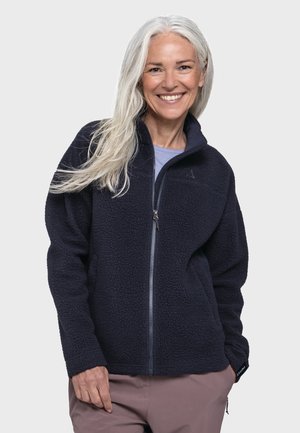 Navy fleece jacket with a full zipper, high collar, and textured surface. Features side pockets and a brand logo on the chest.
