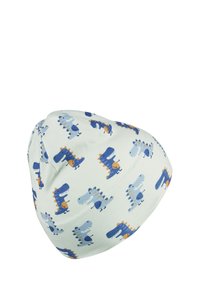 White baby hat with blue and orange cartoon dinosaur patterns scattered across the fabric.