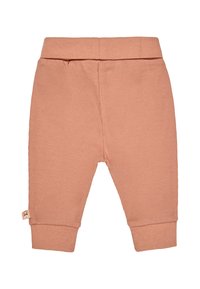 Hosen aus geripptem Stoff in sanftem Pfirsichton. Mit einem breiten elastischen Bund und schmal zulaufenden Säumen. Kleine Marke an der Seite.