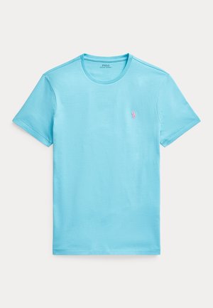 Błękitna bawełniana koszulka z krótkim rękawem i okrągłym dekoltem. Posiada małe różowe haftowane logo na lewej piersi.