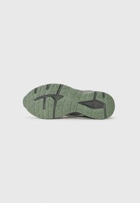 Rubber athletic shoe sole in green with a geometric tread pattern. Features a flat base and a slight heel rise.