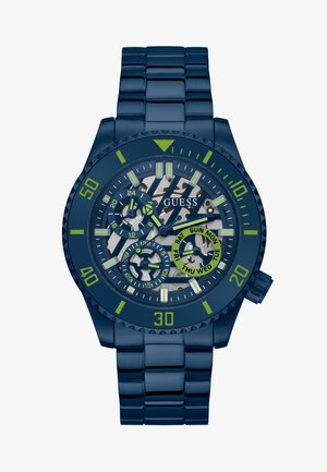 Granatowy zegarek z bransoletą ze stali nierdzewnej, z czarnymi i zielonymi akcentami, wielofunkcyjną tarczą wyświetlającą dni i format 24-godzinny, teksturowaną lunetą.