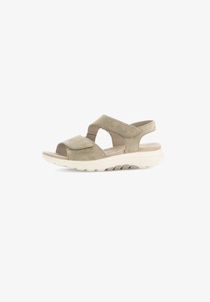 Beige Wildledersandalen mit offenem Zehenbereich und verstellbaren Klettverschlüssen. Strukturiertes Profil für Grip und Komfort, ausgestattet mit einem gepolsterten Fußbett.