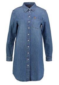 Långärmad denimklänning med krage, framtida knappar, bröstficka och något rundad nederkant i medelblå tvätt.