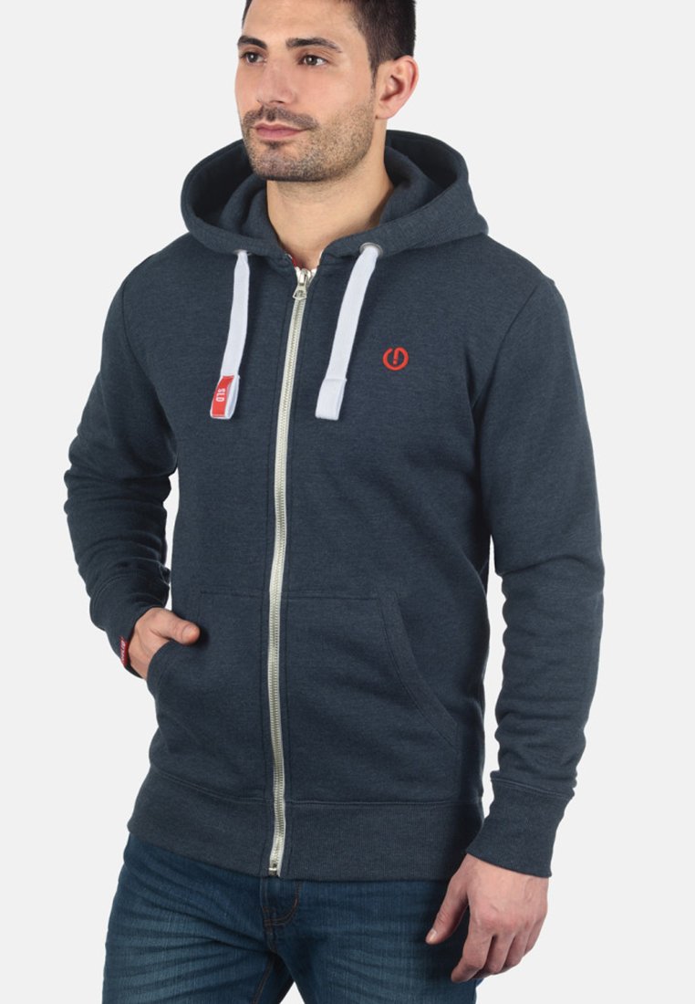 Dark grey zip-up hoodie made of cotton blend, featuring a front zipper, white drawstrings, and a small red logo on the chest.