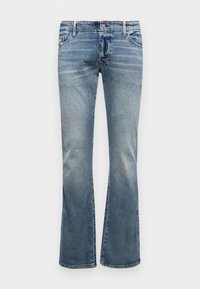 Jeans de mezclilla azul de campana con un acabado desgastado, que cuentan con una cintura estándar, pasadores para cinturón y dos bolsillos delanteros.