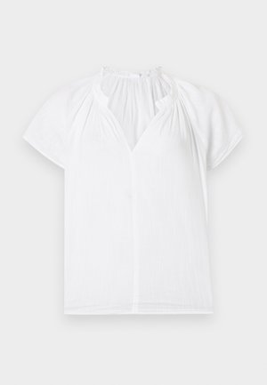 Baltas trumpomis rankovėmis palaidinė su surinktiniu, raukšlėtu apykakliu ir V formos priekiu, eksponuojama ant šviesaus fono.