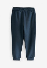 Marina joggers tillverkade av mjukt tyg, med elastisk midja, tapered ben-design och åtsittande muddar vid anklarna.