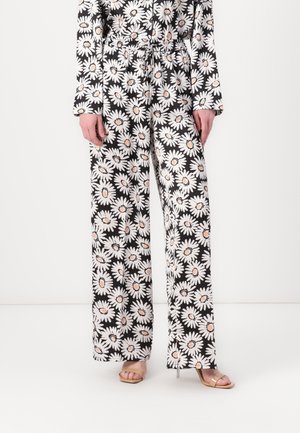 Pantaloni a gamba larga con stampa floreale, che presentano margherite su uno sfondo nero, con una vita elastica e una vestibilità rilassata. Tessuto morbido.