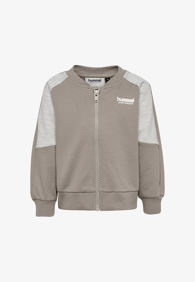 Jasnoszara bluza na zamek z kontrastującymi jasnoszarymi rękawami, prążkowanymi mankietami i dołem. Na piersi znajduje się logo „hummel”.