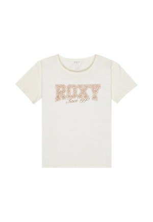 Camiseta crema con la palabra "ROXY" en una fuente audaz y estilizada, junto a "Desde 1990" en una escritura más pequeña abajo.