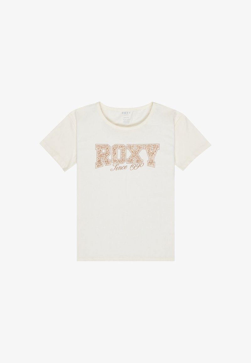 Kreem värvi T-särk, millel on julge ja stiliseeritud kiri "ROXY" ning allpool väiksem skripti tüpograafia "Since 1990".