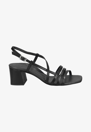 Black heeled sandals with multiple thin straps, a square open toe, and a block heel. Made of a smooth, glossy material.