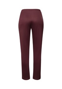 Burgunderfärgade byxor med elastisk midja och tapered design, tillverkade av ett slätt, stretchigt tyg, med en enkel, enfärgad look utan dekorationer.