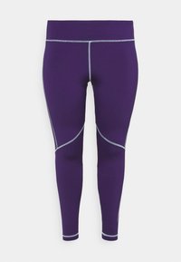 Fialové sportovní legíny s hladkým materiálem, zdobené šedým švem a akcenty z panelů podél nohavic. Navrženo pro aktivní nošení.