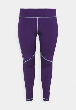 Fialové sportovní legíny s hladkým materiálem, zdobené šedým švem a akcenty z panelů podél nohavic. Navrženo pro aktivní nošení.