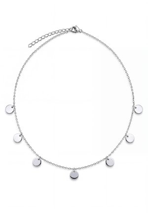 Un bracelet chaîne en argent avec sept breloques rondes et plates en forme de disque et une chaîne de rallonge réglable, présenté sur un fond blanc.