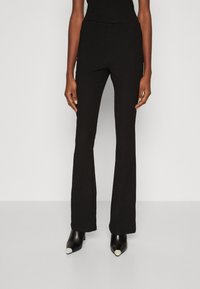 Calvin Klein CRINKLED FLARED - Pantaloni - black