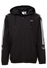 Svart huva jacka med full dragkedja, vita ränder på axlarna och logotypdetaljer på bröstet och ärmarna. Tillverkad av lätt material.