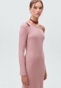 Ribbed, one-shoulder pink knit dress with long sleeve and a cut-out detail. Fitted silhouette, smooth texture, and knee-length design.
