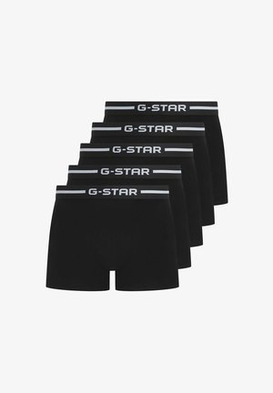 Slip neri boxer in un pacco da cinque, con un elastico G-Star decorato da una striscia grigia. Il tessuto sembra liscio ed elastico.