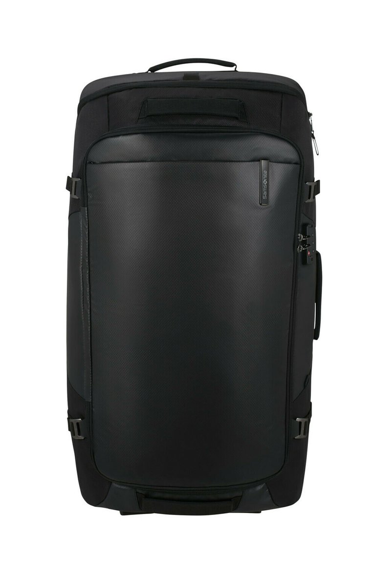 Black travel bag with a textured finish, large front panel, side handle, and adjustable straps, designed for durability and functionality.