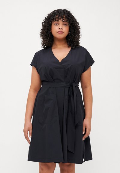 Black dress with a V-neck, cap sleeves, and a tie belt at the waist. Features two front pockets and a flowing A-line shape. Smooth fabric texture.