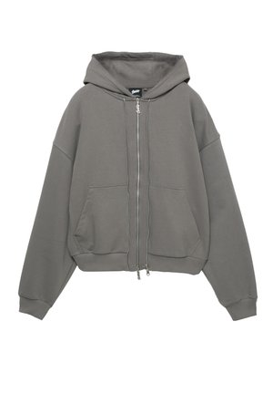 Felpa con cappuccio grigia con zip, cappuccio ampio, polsini e orlo a coste, e due tasche frontali. Realizzata in un materiale morbido e strutturato.