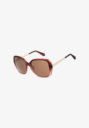 Übergroße quadratische Sonnenbrille mit braun getönten Gläsern, transparentem braunem Kunststoffrahmen und dünnen goldfarbenen Metallbügeln mit schwarzen Enden.