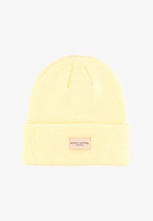 Geel gebreide muts met een opgevouwen boord. Heeft een label met de merknaam "BICKLEY + MITCHELL". Gemaakt van zachte, gestructureerde stof.