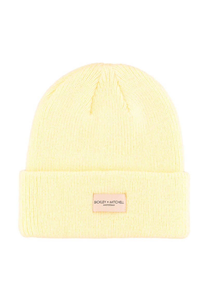 Geel gebreide muts met een opgevouwen boord. Heeft een label met de merknaam "BICKLEY + MITCHELL". Gemaakt van zachte, gestructureerde stof.