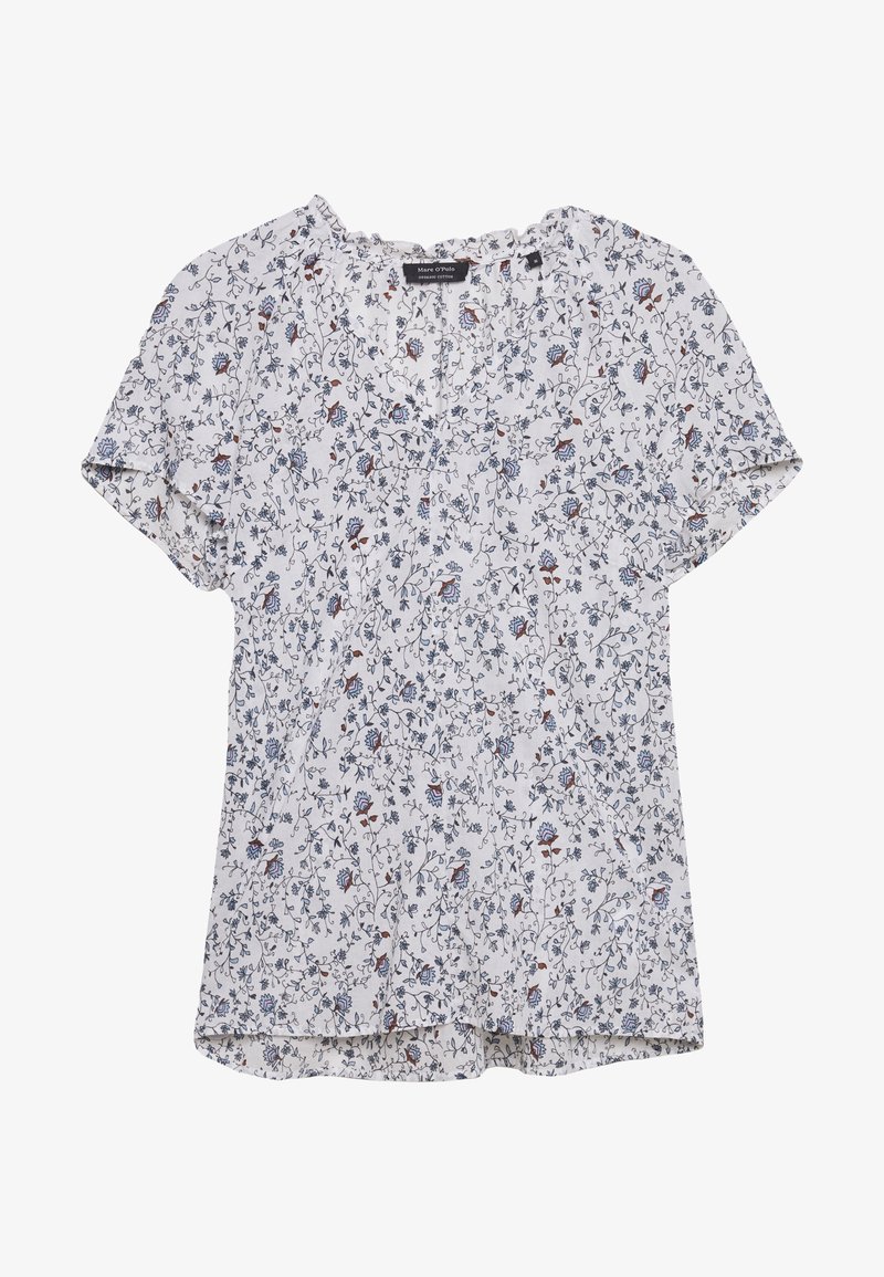 Blouse à manches courtes à motif floral blanc, avec des fleurs bleues et rouges, un décolleté en V et un ourlet légèrement incurvé. Tissu léger.