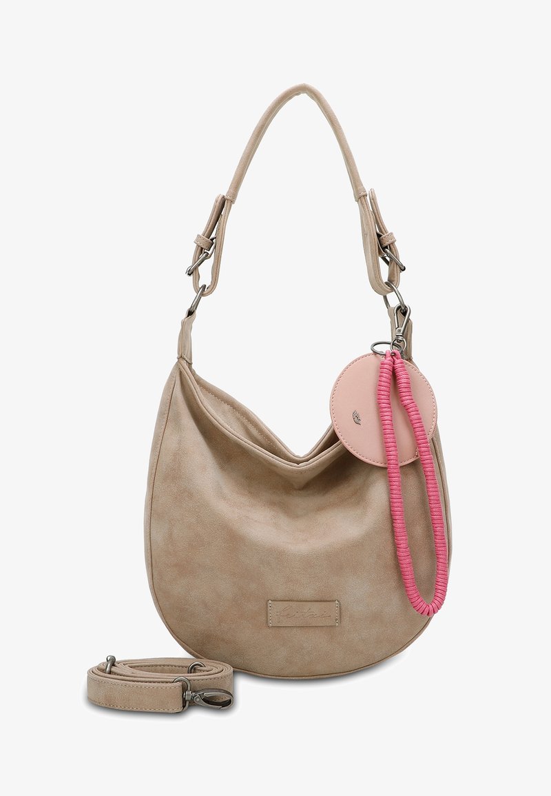 Beige faux suede handbag with a hobo shape. Features a short handle, detachable shoulder strap, and pink circular tag with cord.