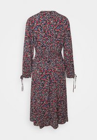 Navy floral dress with long sleeves, cinched waist, and tie details on sleeves. Features a multicolored flower pattern on a dark background.