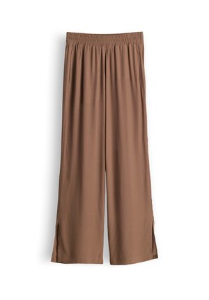 Braune Hose mit weitem Bein, elastischem Bund, Seitentaschen und kleinen Schlitzen am Saum, flach auf weißem Hintergrund liegend dargestellt.