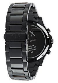 Schwarze Edelstahl-Uhr mit einem schlanken, segmentierten Armband; verfügt über ein rundes Ziffernblatt mit silbernen Akzenten und einem minimalistischen Design auf dem Zifferblatt.