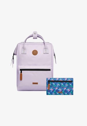 Lilac backpack with a textured surface, zip pockets, and leather accents. Includes a smaller blue floral-patterned pouch.