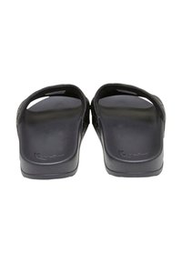 Black slide sandals with a smooth texture, open toe design, and slight elevation at the heel. Features a branded logo on the sole.