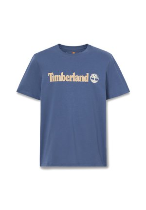 T-shirt blu a maniche corte con girocollo, con logo Timberland beige e simbolo dell'albero centrati sul petto.