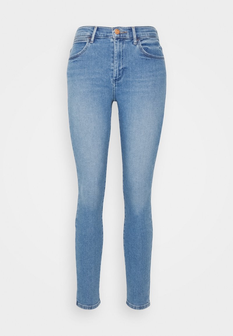 Jasnoniebieskie dżinsy damskie wykonane z denimu. Posiadają dopasowany krój, pięć kieszeni oraz zapięcie na guzik w talii.