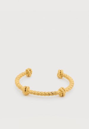 Open-ended gold bracelet with textured twisted design and three raised knot-like details on each side.