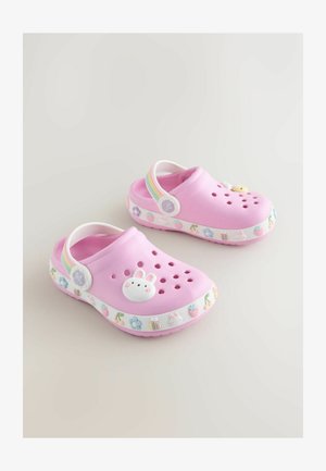 Roosad kummist klotsid ventilatsiooniavaite, dekoratiivse jänku ja lillemotiividega. Valge tald väikeste värvikate aktsentidega ümber tallal. Vikerkaarevärvi rihm.