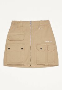 Beige nytta kjol med elastisk midja, fram Zip och fyra stora fickor. Har "CYBER PAL" broderat i vitt.