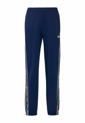 Granatowe spodnie dresowe z elastycznym pasem, elastycznymi mankietami, bocznymi paskami z kolorowym wzorem paisley oraz małym białym logo Adidas na lewym udzie.
