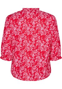 Blusa rossa con motivo floreale bianco. Presenta maniche arricciate e colletto alto. Tessuto morbido, vestibilità leggermente rilassata e orlo arrotondato.