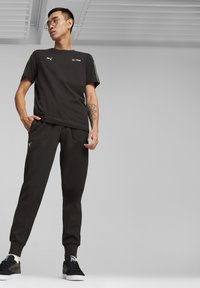 Puma MERCEDES-AMG PETRONAS MOTORSPORT - Jogginghose - black/schwarz - Zalando