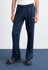 adidas Originals - FLARE - Tracksuit bottoms - aurora ink Thumbnail Image 1