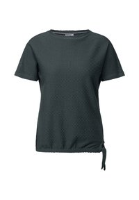 Haut vert foncé à manches courtes avec un motif texturé en nid d'abeille et un côté froncé comportant un détail de lien. Encolure ronde classique.
