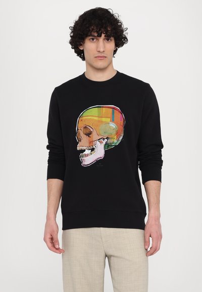 Sort sweatshirt med et farverigt kraniegrafiktryk; crew neck design, ribbede manchetter og kant. Glat tekstur, ingen synlig hardware.